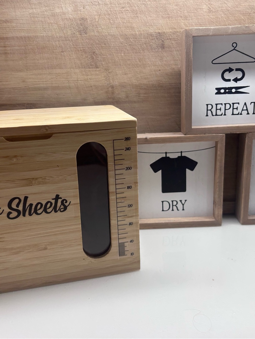 Bamboo Laundry Sheets Dispenser - Natural Bamboo and framed signs